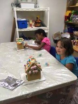 Victoria and Brooke enjoy decorating their masterpieces.