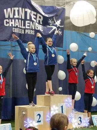 Giant Gymnastics has a banner year Kate Sutphen in first place and Kacy Biddescombe in second place at Chelsea Piers, Conn.