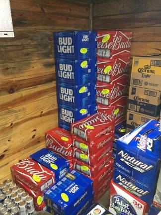 Local sticker shock events engage youth in underage drinking prevention Woody's Liquor Store in Sussex.