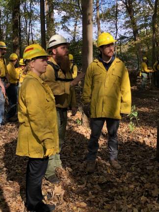 Lighting a fire under science students High Point science teachers Liana Hennings and Chris Gocklin helped start the prescribed burn, which was supervised by Nick Valerio, section fire warden A1 with the New Jersey Forest Fire Service. (Photo by Kathy Shwiff)