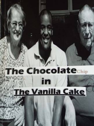Wantage writer completes first novel, begins second PHOTOS BY VIKTORIA-LEIGH WAGNER Martin Novak (center) is featured on the cover of his first novel, 'The Chocolate Chip in the Vanilla Cake,' between his adoptive mother Cheryl (L) and father Larry (R).