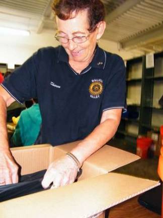 Wallkill Valley Rotary Club 560 President Sharon Hosking, now in her fourth term, counts 24 heavy duty trash bags per flood bucket. Recently, the Rotary Club provided the Skylands Outreach Depot with a grant of $4,500 to go towards disaster relief efforts.