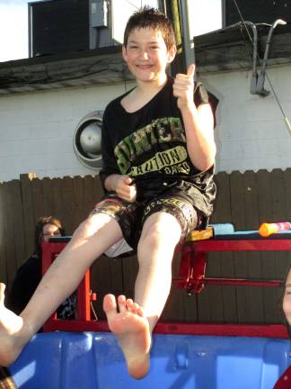 Sussex Elks host summer barbecue Sussex Elks volunteer Austin McLellan, 12 of Sussex getting dunked.