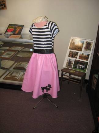 A poodle skirt outfit is on display at the society&#xfe;&#xc4;&#xf4;s museum.