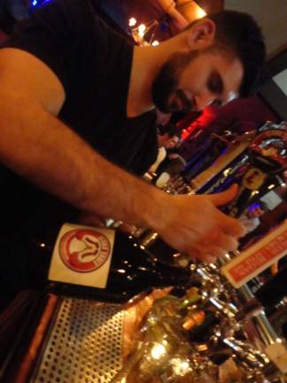 Clown Shoes brewery makes N.J. debut Photos by Scott Baker Bartender John Schlaffe filling a growler at the Mohawk House in Sparta.