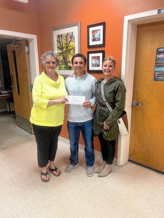 Baumann awarded scholarship <b>From left, Jill Deyoung, president of the Vernon Township Republican Organization, with scholarship recipient Matt Baumann and his mother. (Photo provided)</b>