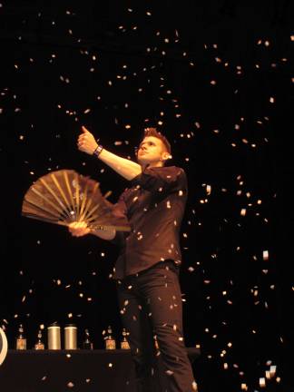 Joel Meyer performs at SCCC Magician Joel Meyer produces flurries of paper snow from a small, single slip of paper.