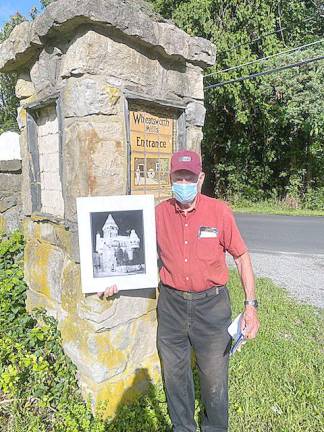Castle Keeper’s memories help bring fairytale kingdom back to life The Castle Keeper, 92-year-old Bob Allen, stands by one of the castle's Flint Faience tiles. When Allen was a lad, an 85-year-old gentleman proudly showed him the tile, which remains at the entrance to the castle. He said to Allen, See that tile with the man on the broom? That's me. (Photo by Laurie Gordon)