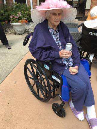 Eileen DeGroat celebrates her 100th birthday with a birch beer.
