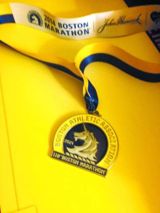 Locals finish strong at Boston Marathon Boston Marathon finisher's medal.