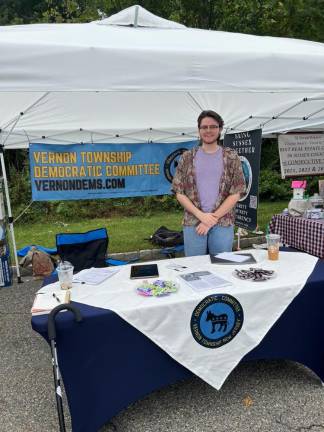 Jimmy Peck, secretary of the Vernon Democratic Committee, offers information at the street fair.