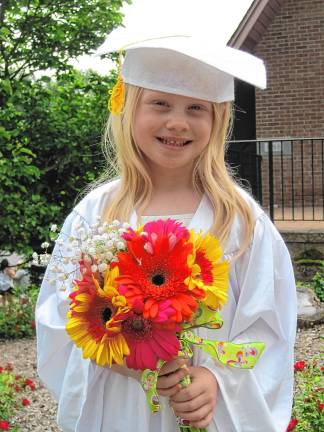 Preschool’s last graduation Charlotte Cady, 5, at the preschool graduation.