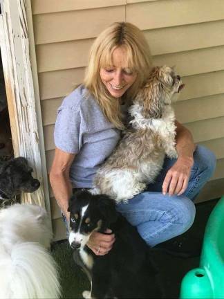 Sussex County dogs getting sick despite vaccines Pet Spa & Resort owner Lynn Wilkins with some of her guests.