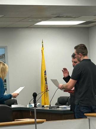 Councilman Martin Kokorunda takes the oath of office.