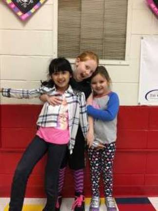 Isabelle, Kaylee and Riley pose for the camera at Hamburg K.E.E.P.