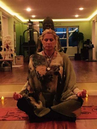 Wellness Center opens in Vernon Catherine Stone, owner of Just Breathe Wellness Studio, instructs a meditation class.