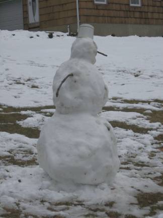 PHOTO BY JANET REDYKE This snowman was spotted out front a home on Route 515, after Saturday's snowstorm.