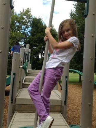 Shayla plays on the playground.