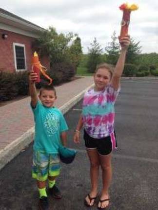 Travis and Delaney prepare for the torch relay.