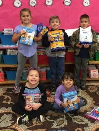 Sussex-Wantage schools begin pet supply drive Front row left to right: Lucy Gould and Rama Alkiswani.