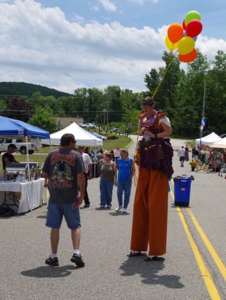 Rising above it all was stilt walker Cortney Gwenn Sky Sprite who at first mingled with fair goers and then walked down to Route 515 to try to attract more visitors.