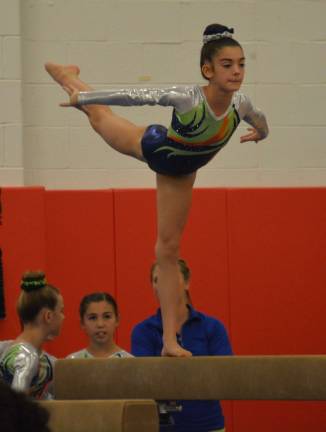 Meagan Ward of Stillwater on the balance beam at the Acorn Cup.