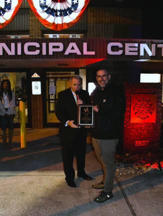 Vernon Township dedicates first responders memorial. <b>Vernon Township Mayor Anthony Rossi presents a plaque to Kevin Rudolph for donations made to all four township fire departments.</b>