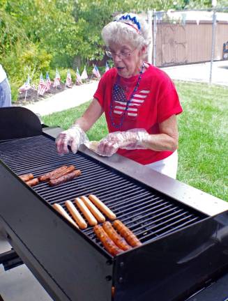 Senior center worker Carol Gormley of Franklin was one of the grill masters for the picnic.