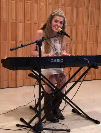 Charity concert raises $800 Queen of the Fair Kelly Wask performs