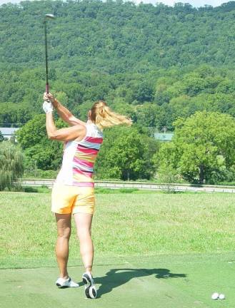 Final Crystal Cup qualifiers set Women’s Long Drive Winner Dona Wallerius warming up for the final Crystal Cup Qualifier at the Crystal Springs Golf Club.