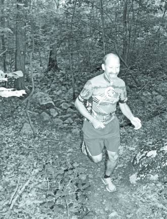 Salt Shakers Shake Up The Wilderness Robbie Davidson, Founder and President of the Salt Shakers, makes his way through the woods during a trail run.