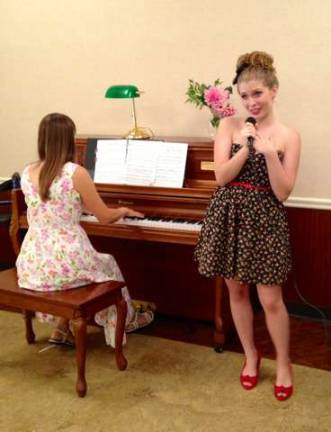 High Point junior sings for seniors Kelly Wask singing at Barn Hill Cair Center.