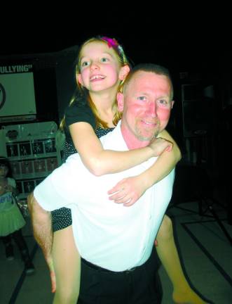 Russell Teague is shown with his daguther, second-grader Rachel Teague, 8.