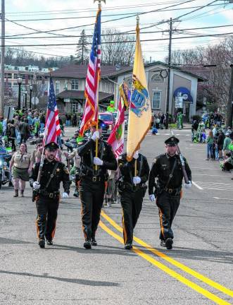 The Sussex County Sheriff’s Department Color Guard leads the parade.