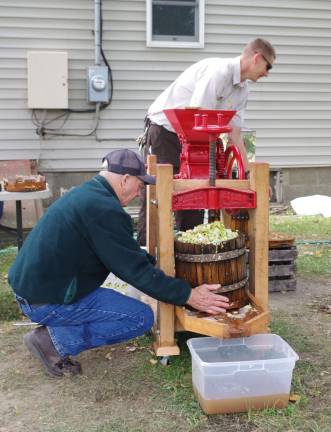 Making apple cider the old fashioned way.