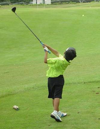 Steven Viray demonstrates great form as he tees off on the eighth hole.