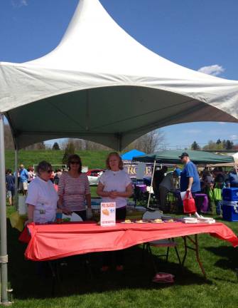 Women at the festival sold slices of homemade apple pie for a dollar. Contestants in the professional and amateur divisions of the competition had to provide two identical pies: one to be judged and one to be sliced and sold.