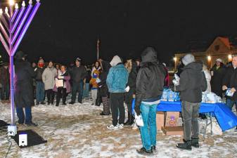 Photos: Menorah lighting in Vernon <b>Residents gather for a menorah lighting Thursday, Dec. 26 in Vernon. Candles traditionally are lit in menorahs for each of the eight nights of Hanukkah. The Jewish holiday began Dec. 25 and ends Jan. 1. (Photo by Maria Kovic)</b>
