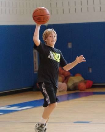 Matthew Hermes, 10, of Newton, is shown with the ball.