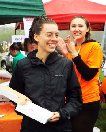 Aimee Chegwidden, 27, of Hamburg smiles at her accomplishment as the overall women's winner.