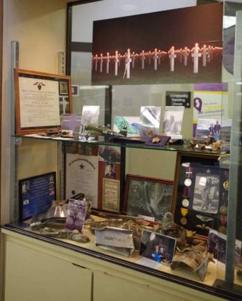 Images of the display cabinet for the presentation of &#x201c;Honoring a Veteran&#x201d; at the Sussex County Library System&#x2019;s Dorothy Henry Branch McAfee/Vernon, N.J.