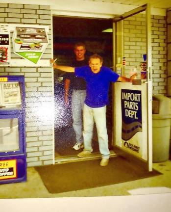 A 1999 photo show Tom Lutz “kicking” Ward Juey Jr. out as Lutz officially became the store’s owner. (Photo courtesy of Dyan Huey-Thompson)