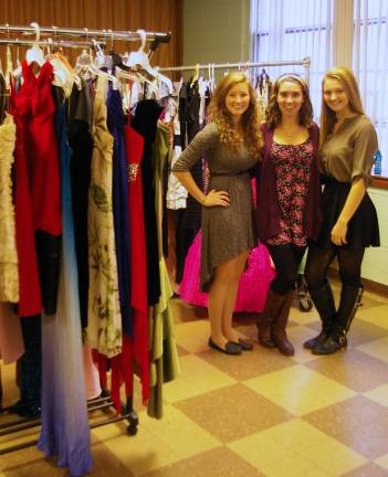 A dress giveaway last Saturday was part of a DECA project organized by Jenna Day, 17, center, of Barry Lakes, and Emily Garosall, left, and Simone Marchesin, right, both 18 from Highland Lakes.