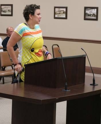 PHOTOS BY MARK LICHTENWALNERBrianna Wagner of Barry Lakes discusses the chicken ordinance.