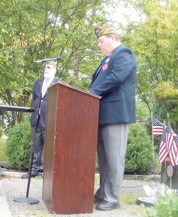 Commander Gregory Protsko addresses the assembly on Patriots Day in Milford, with John Kupillas, Chaplain, VFW Post #8612, on left (Photo by Frances Ruth Harris)