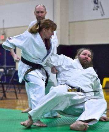 Monica Rolando demonstrating a throwing technique with partner Tim Duvelsdorf.