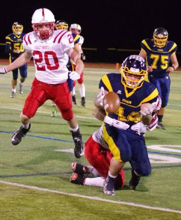 The ball pops loose when Vernon running back Matt Rapisardi is tackled by a Morris Hills defender in the first half.