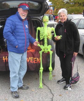 Rich Howes and Dori Zarr get acquainted with a new friend at the Highland Lakes Trunk or Treat.