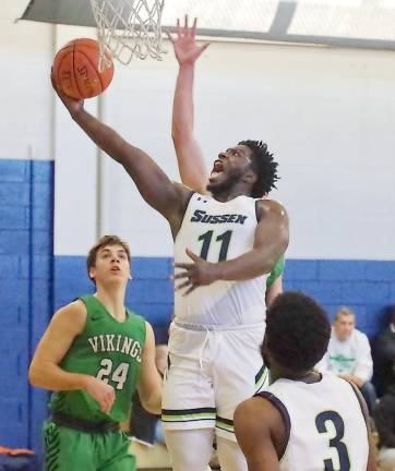 Sussex County's Raymere Grant handles the ball during a shot attempt in the first half.