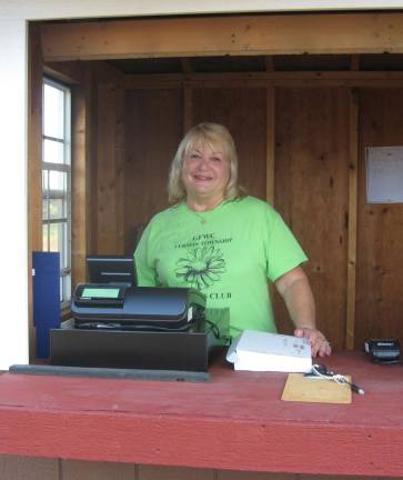 PHOTOS BY JANET REDYKE Vernon Woman&#x2019;s Club volunteer Maria Dorsey works the admission booth with a smile and good advice, &#x201c;Have fun.&#x201d;